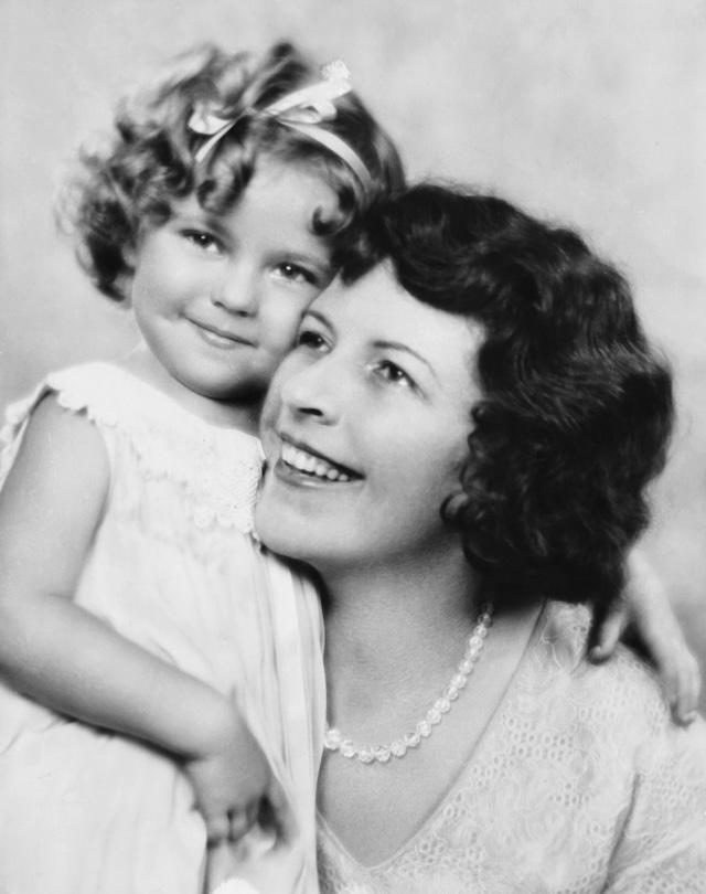 Shirley Temple with her mother, Gertrude, sharing a warm, tender moment