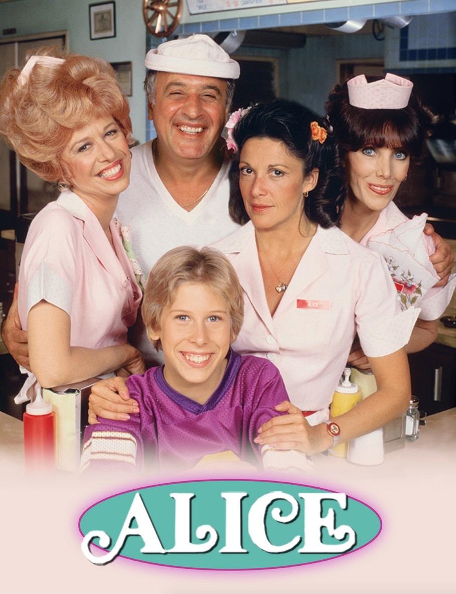 The main cast of "Alice," showcasing the beloved characters of Mel's Diner in their iconic uniforms. The cast includes Linda Lavin as Alice, Vic Tayback as Mel, Polly Holliday as Flo, Beth Howland as Vera, and Philip McKeon as Alice's son, Tommy