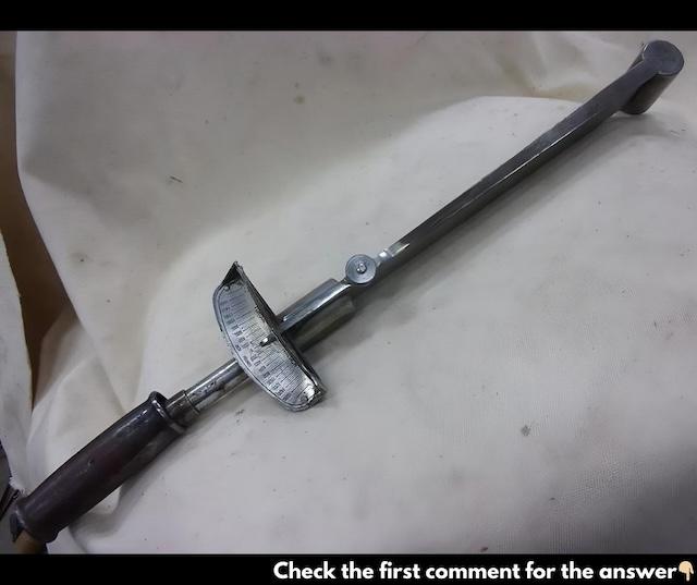 A vintage Craftsman torque wrench, essential for accurate tightening of bolts, commonly used in automotive and mechanical work during the 20th century