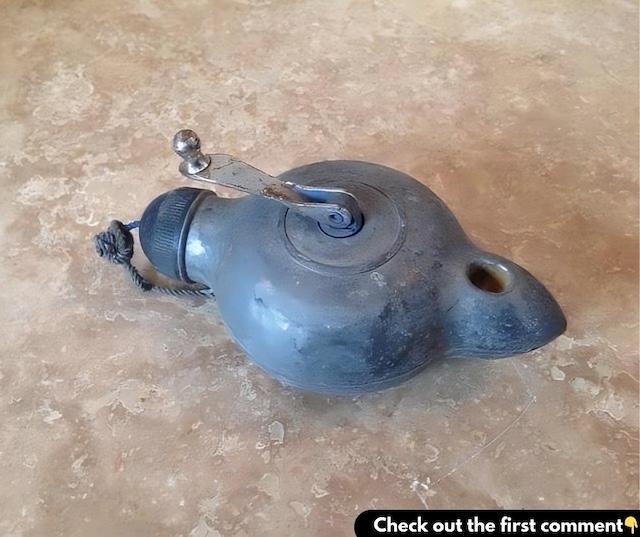 A classic Vintage chalk line tool with a distinctive design, showing wear from years of marking straight lines with precision